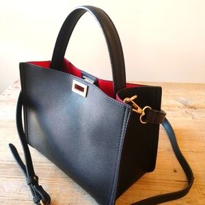 Faux leather mini black bag/red lining